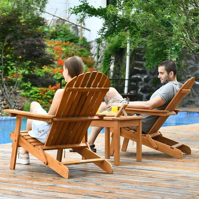 2 peopel sitting in the adirondack chairs in the garden