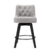 Gray upholstered swivel bar stool  with tufed design,back ,round seat and foot rest