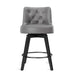 Dark grey upholstered swivel bar stool  with tufed design,back ,round seat and foot rest