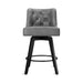 Dark grey upholstered swivel bar stool  with tufed design,back and foot rest