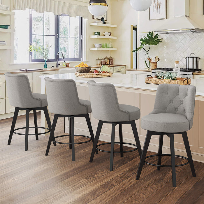 4 pcs gray upholstered swivel bar stool next to  a counter  with tufed design,back ,round seat and foot rest