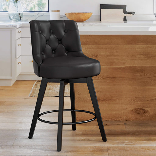 Black upholstered swivel bar stool in a kitchen  with tufed design,back ,round seat and foot rest