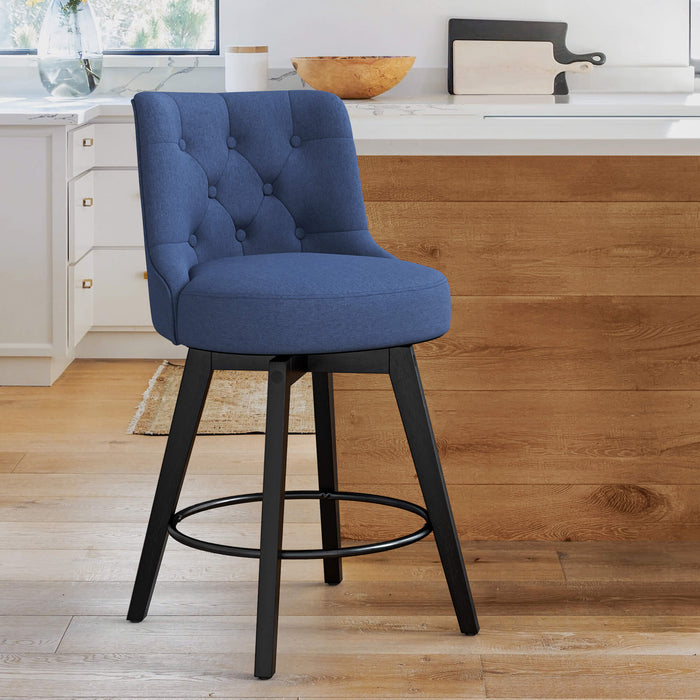 Navy upholstered swivel bar stool in a kitchen with tufed design,back ,round seat and foot rest