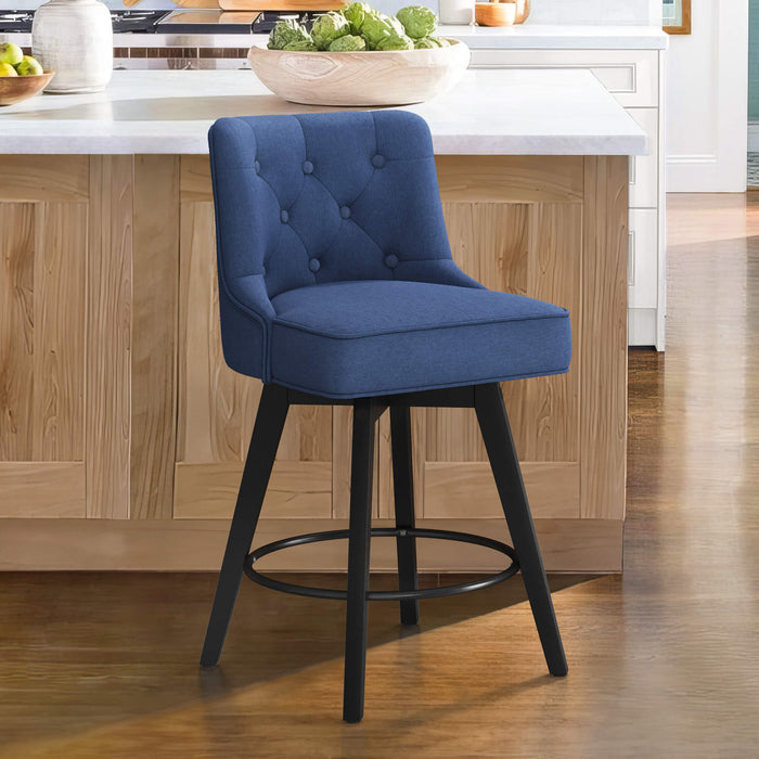 Navy upholstered swivel bar stool in a kitchen with tufed design,back and foot rest