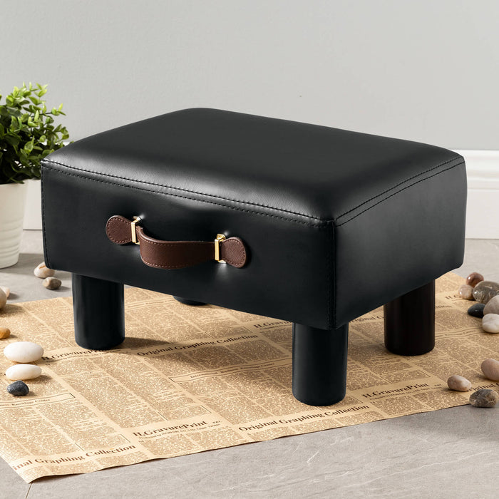black leather cushioned footrest with handle
